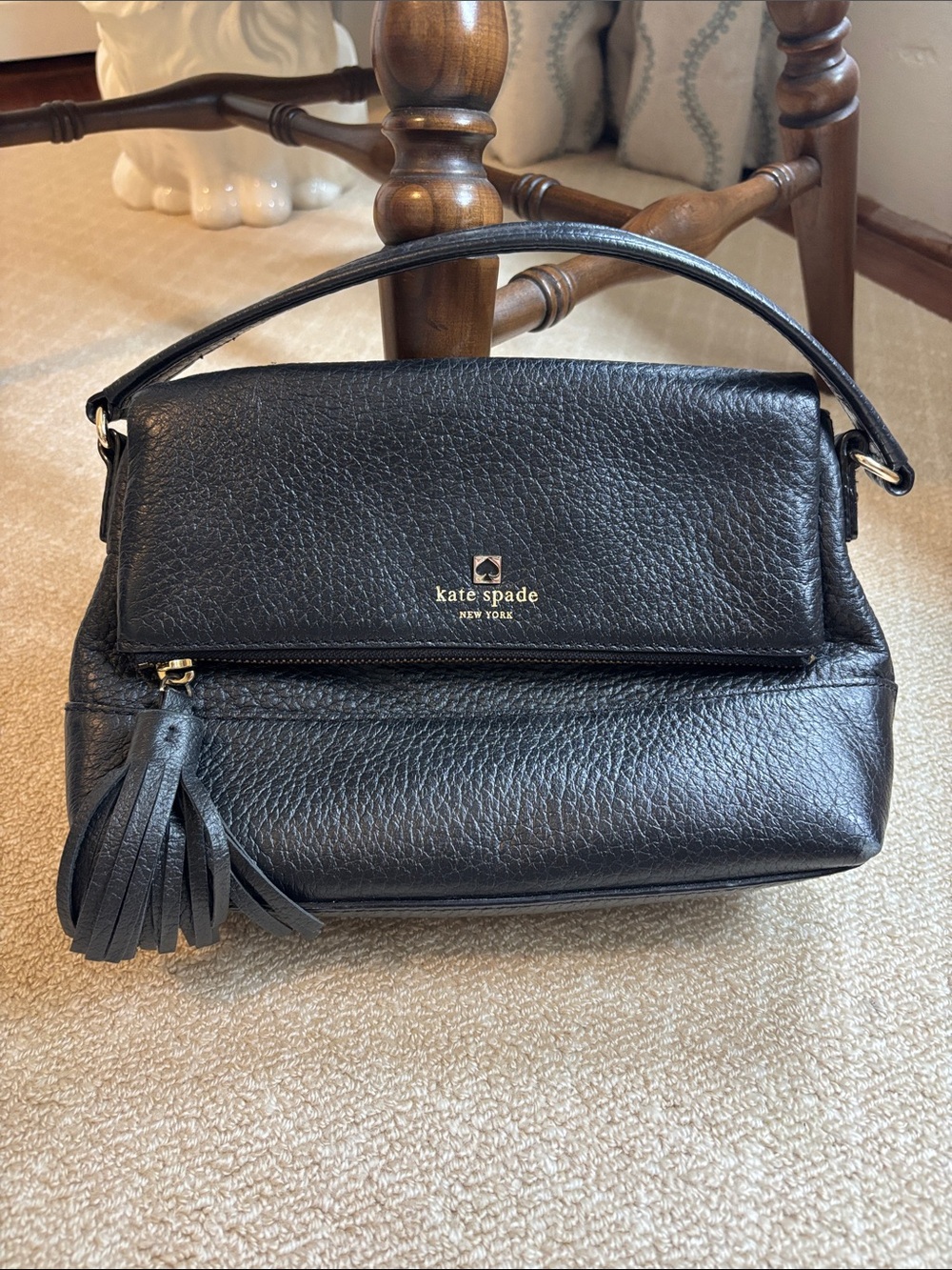 kate spade black pebbled leather bag with tassel